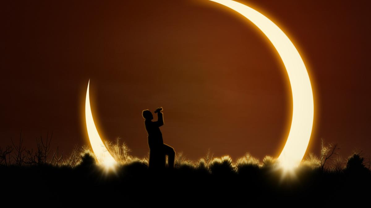 man-using-binoculars-watch-solar-eclipse_89074100
